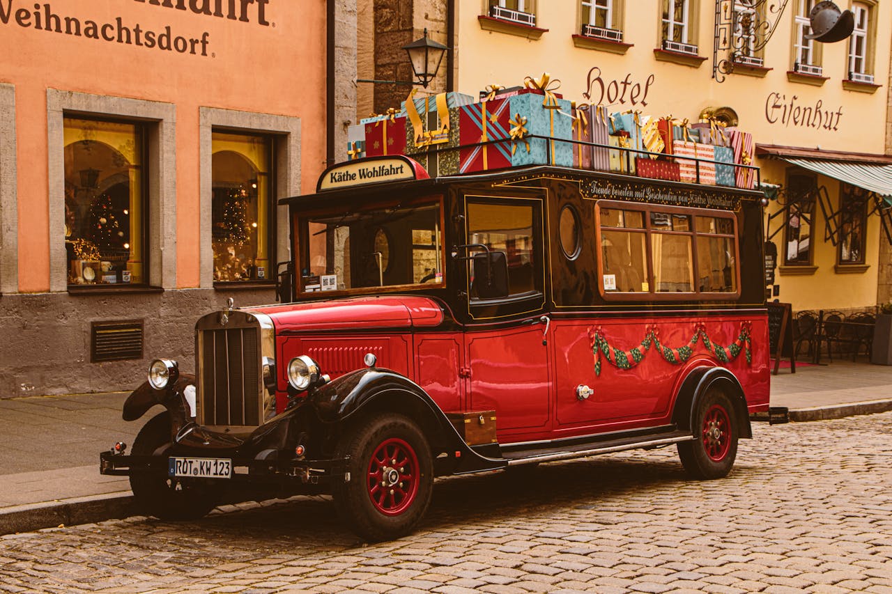 A festive vintage truck decorated for Christmas on a charming street in Schwäbisch Hall.